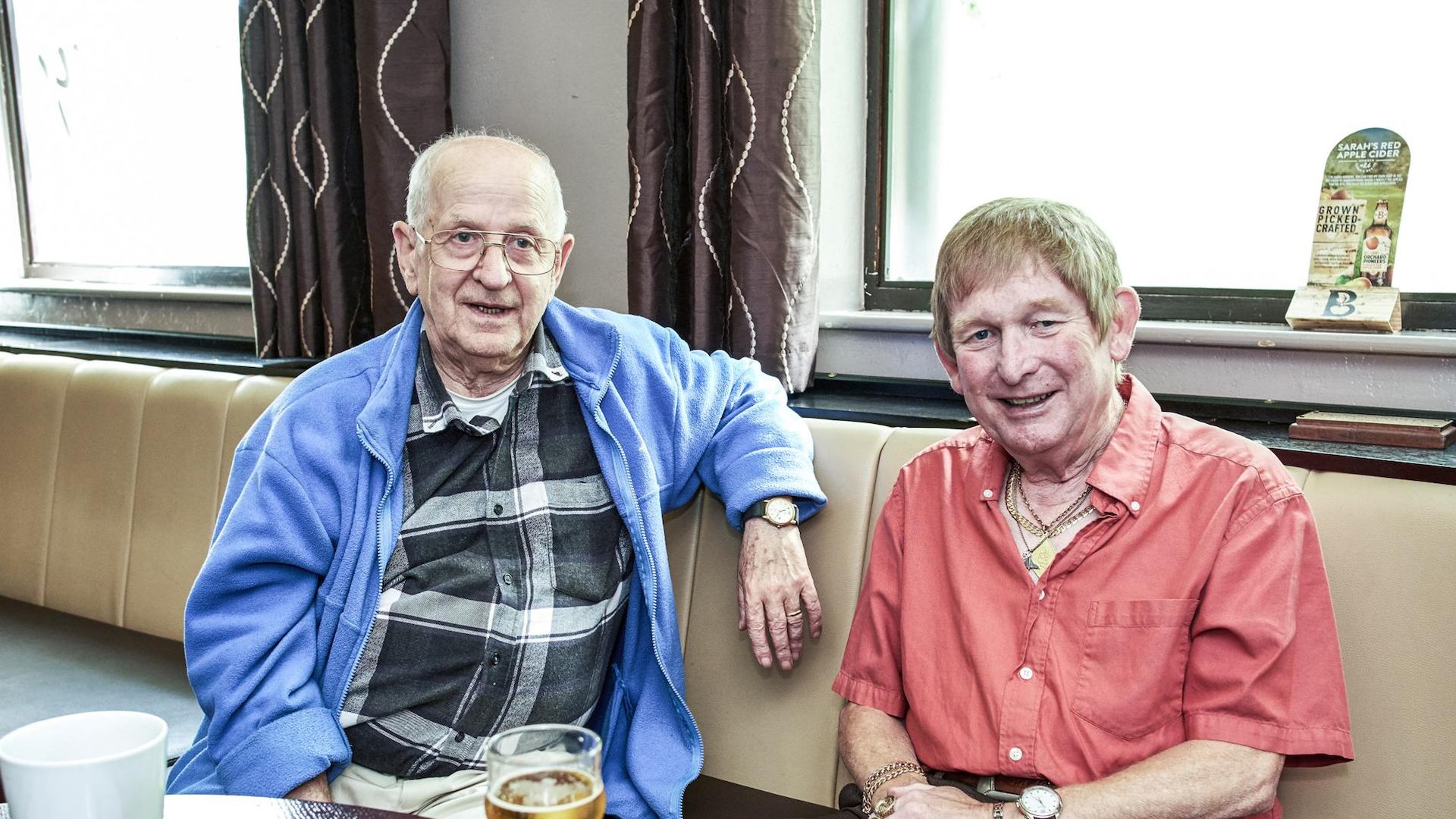 Two older men in a pub