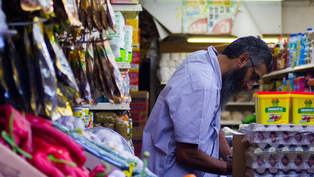 Older worker in market