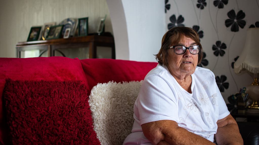 Older woman sitting on sofa