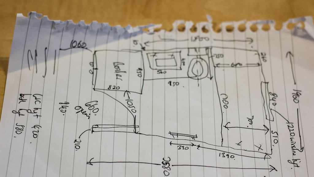 Hand drawn plans on a piece of paper.