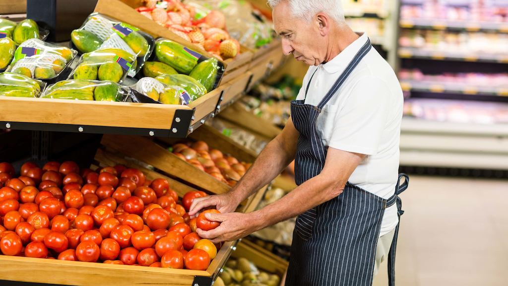 Older male shop worker