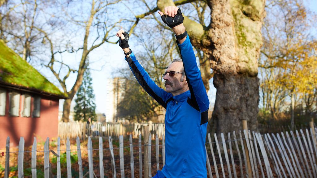 Man stretching in park