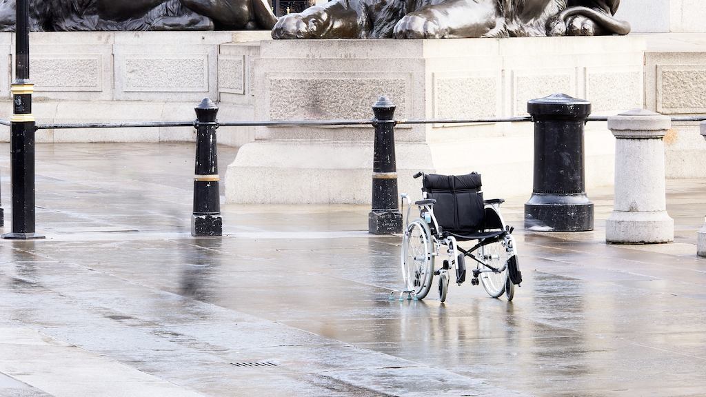 Empty wheelchair in street