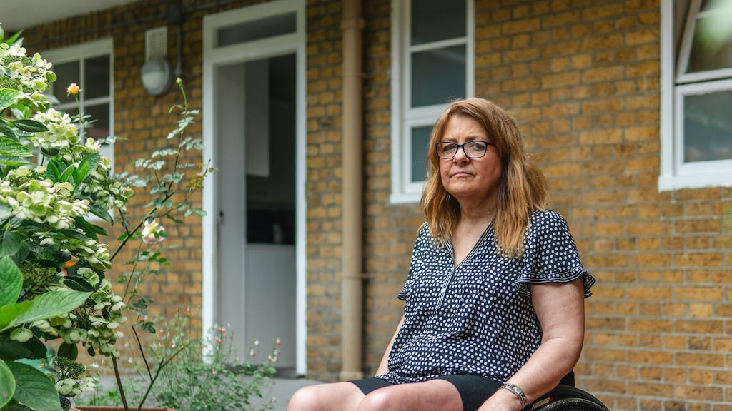Woman in wheelchair looking into the camera