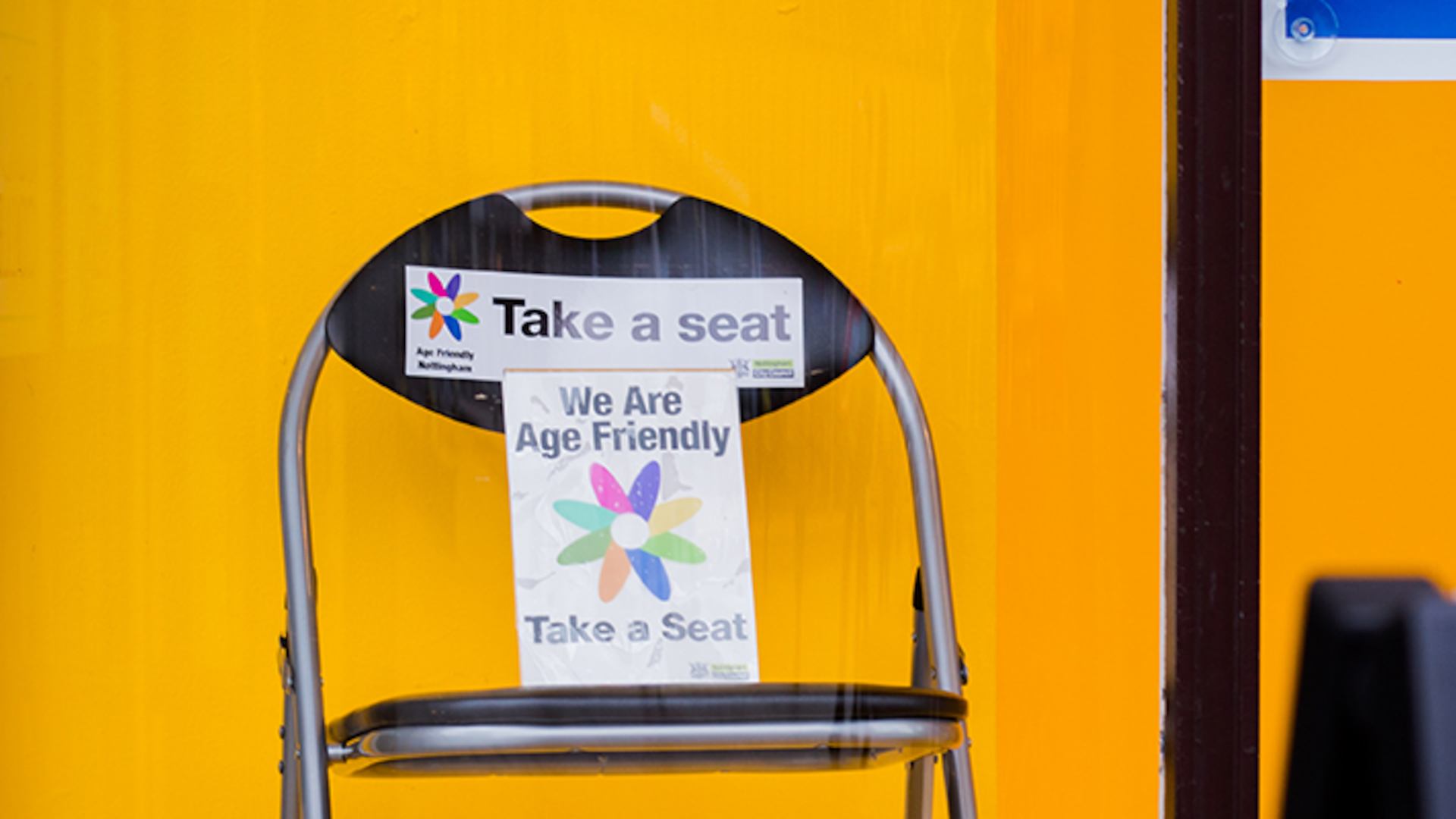 Chair with take a seat sign