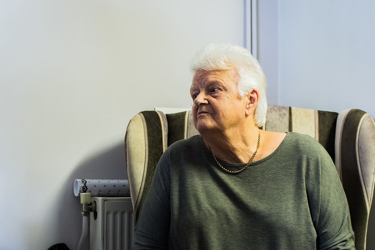 Woman sitting in armchair