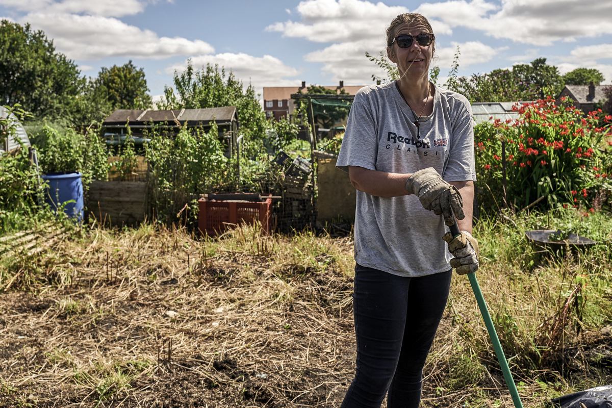 Woman gardening, Gorsehill, Greater Manchester