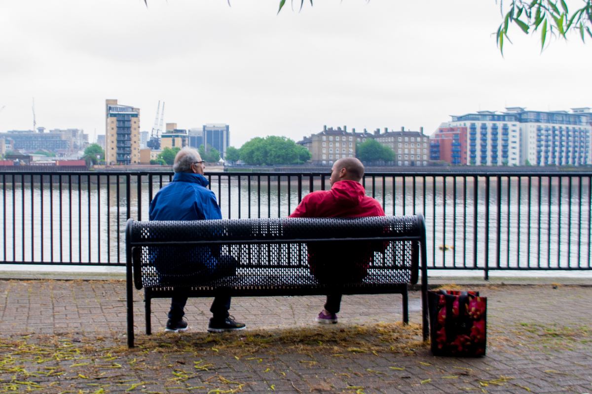 Two men sitting on a bench, Greenwich