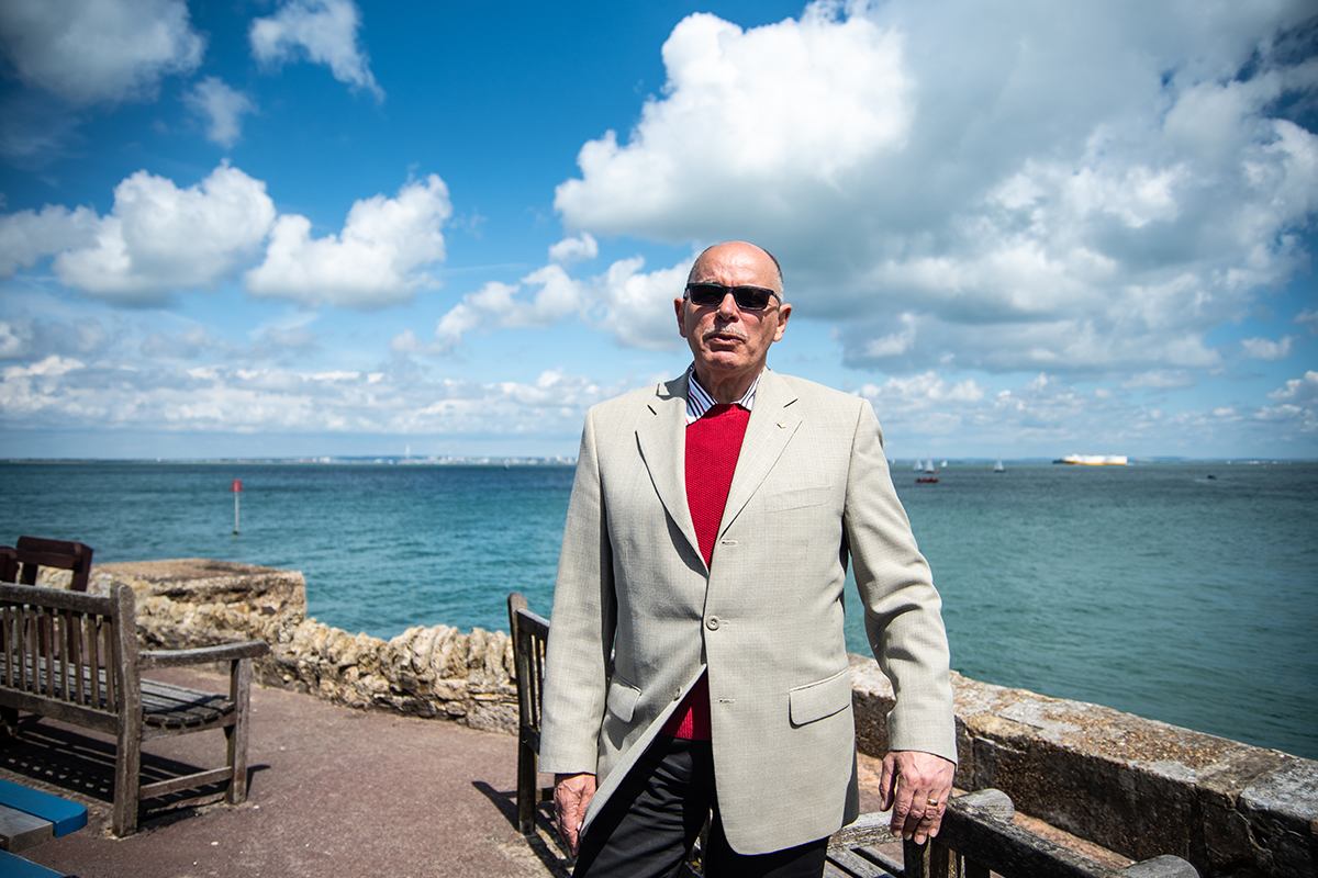 Older person standing by seaside