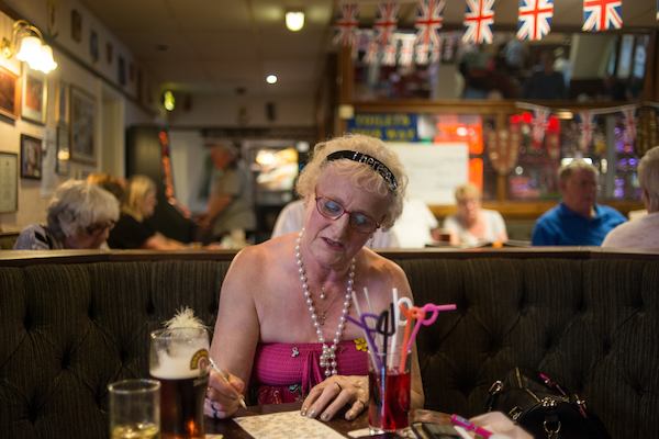 Older woman in the pub